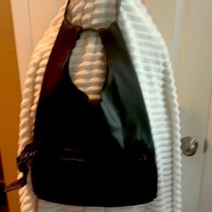 A black leather Tom Ford authentic hand bag